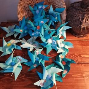 (16) Handmade pinwheels on Summery Blue paper.